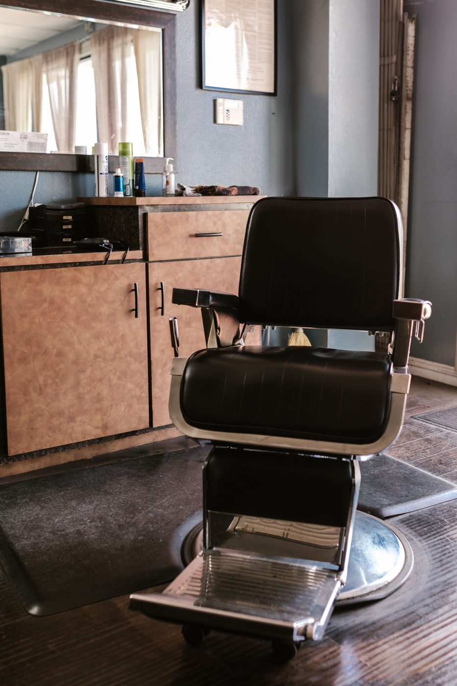 An empty barber chair sitting idle in a shop — every day a station sits unused is revenue a shop owner doesn't get back.